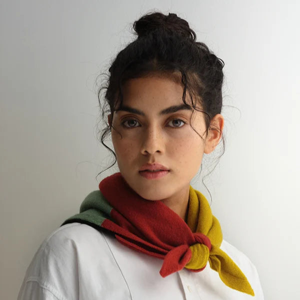 Tri-color wool neck scarf in red, green, and gold.  Tied in a knot at the front.