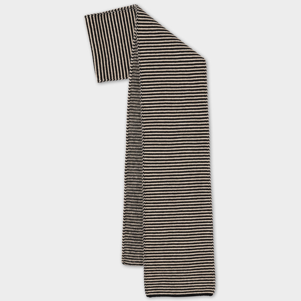Black and cream horizontally striped knitted scarf.