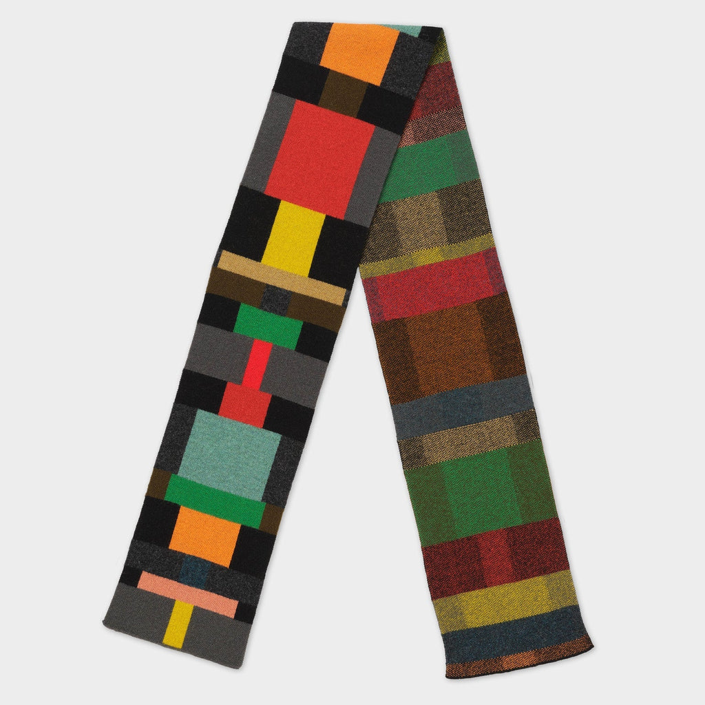 Multicolored wool scarf with geometric and plaid patterns.