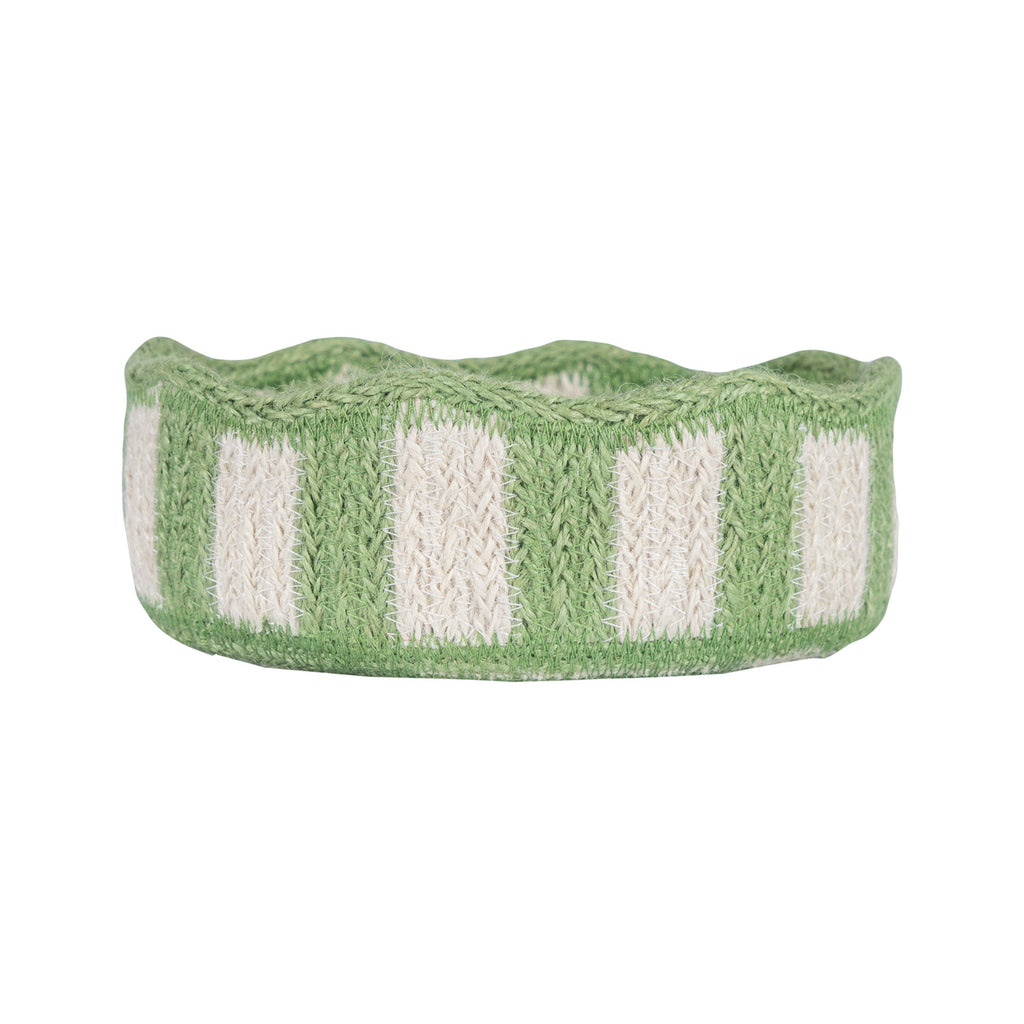 Green and off-white striped knitted basket with a wavy top edge.