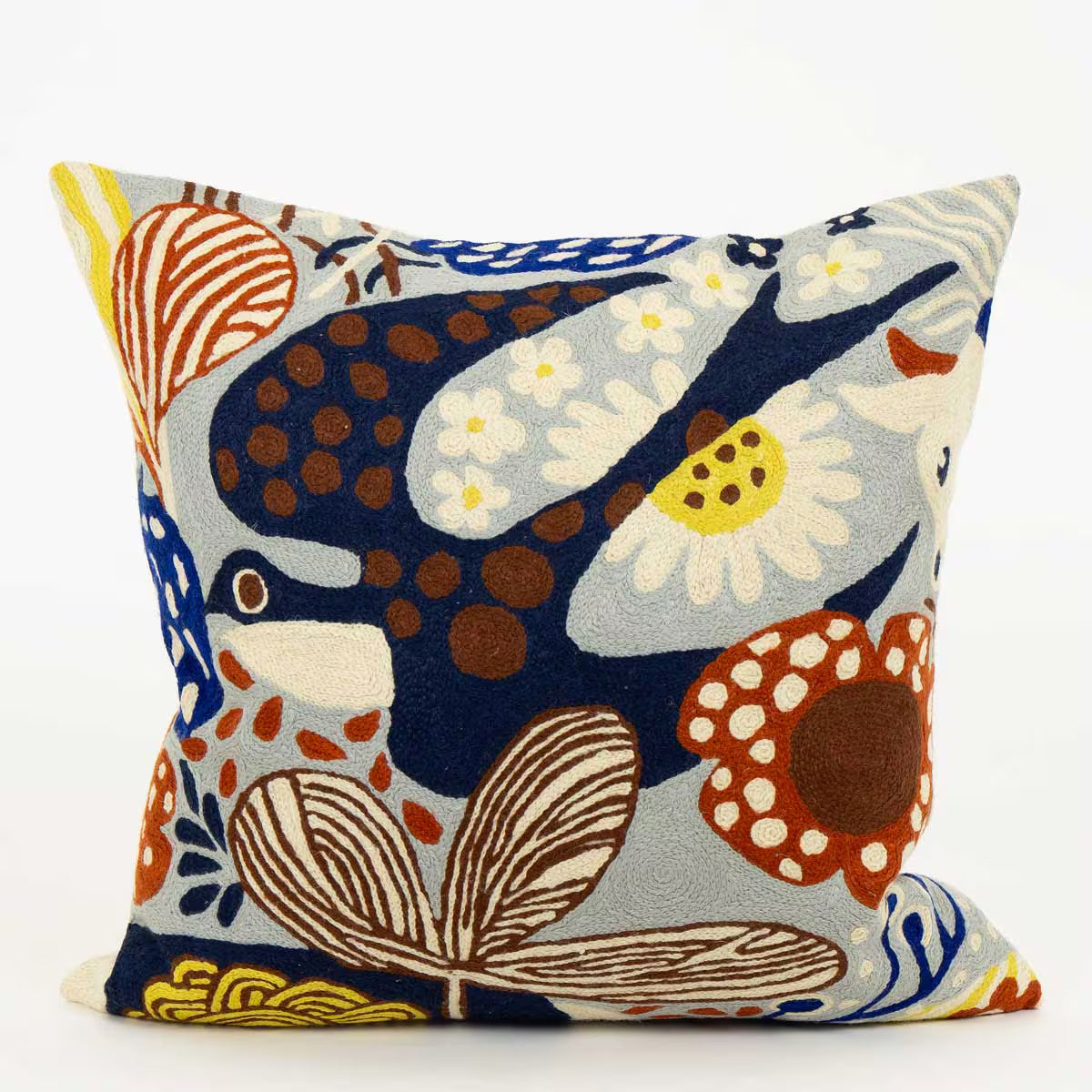 Pillow with flying blue bird 