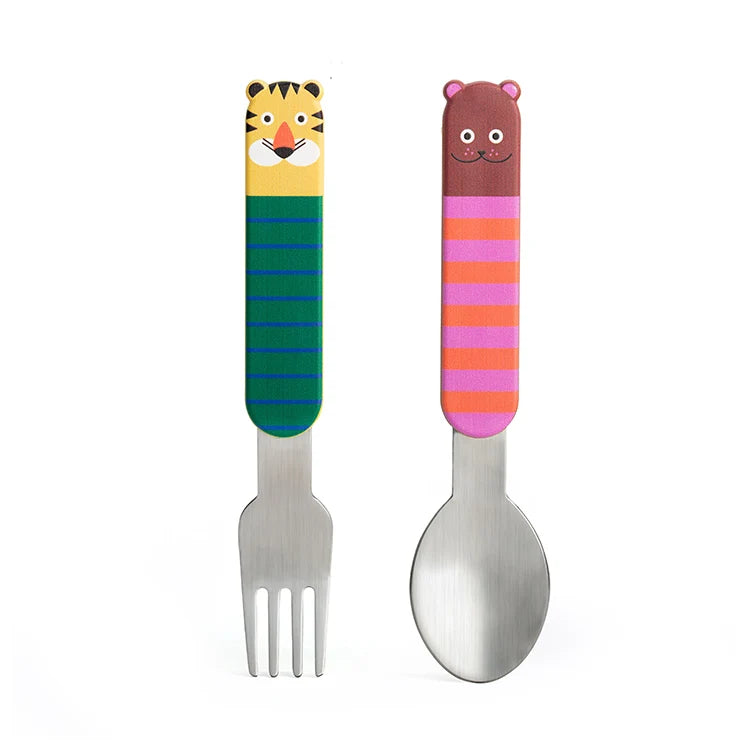 Two children's metal utensils with colorful cartoon animal handles, a tiger-spiked fork on the left and a bear-spiked spoon on the right, set against a plain white background.