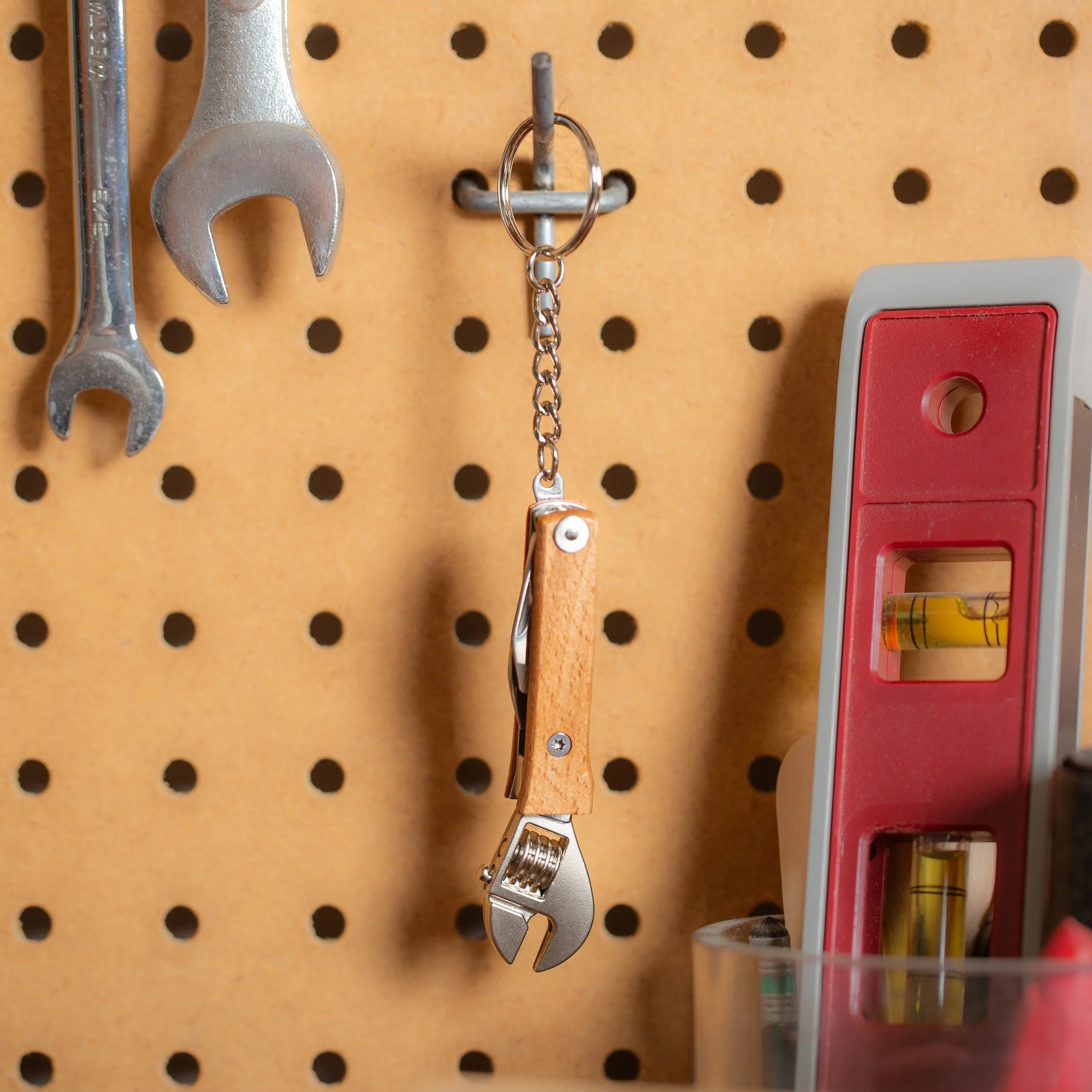 Wrenches and a level on a pegboard