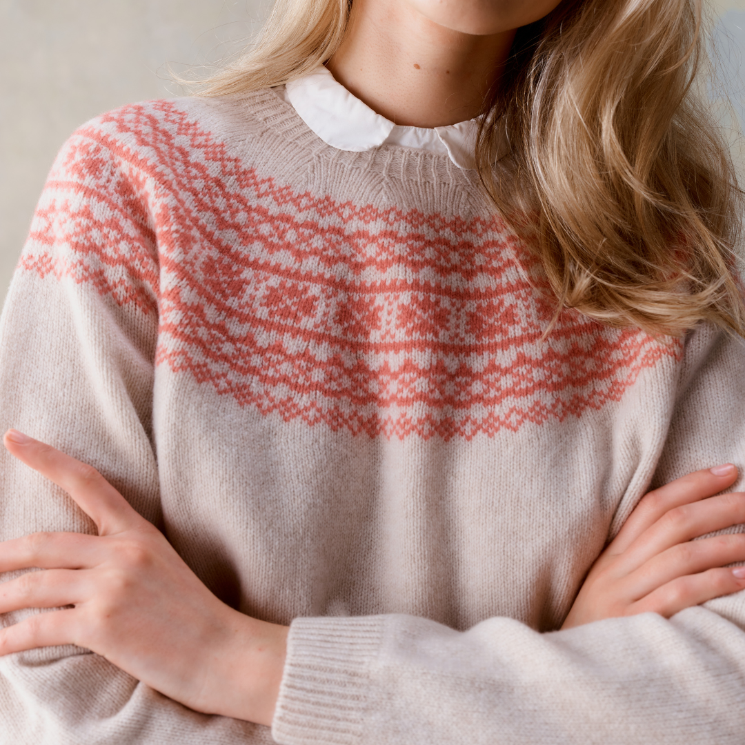 Beige cashmere sweater with a salmon-pink Fair Isle yoke.