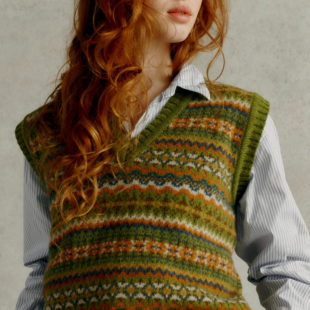 close up of a red haired female model wearing a Harley of Scotland Fairisle Slipover - Olive Grove