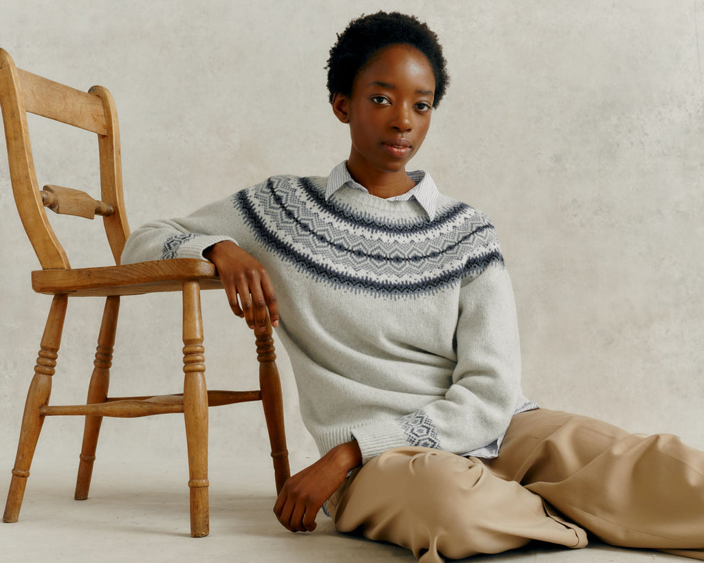 woman sat on floor leaning on a chair wearing a Harley of Scotland Ladies Yoke Jumper - Nuage