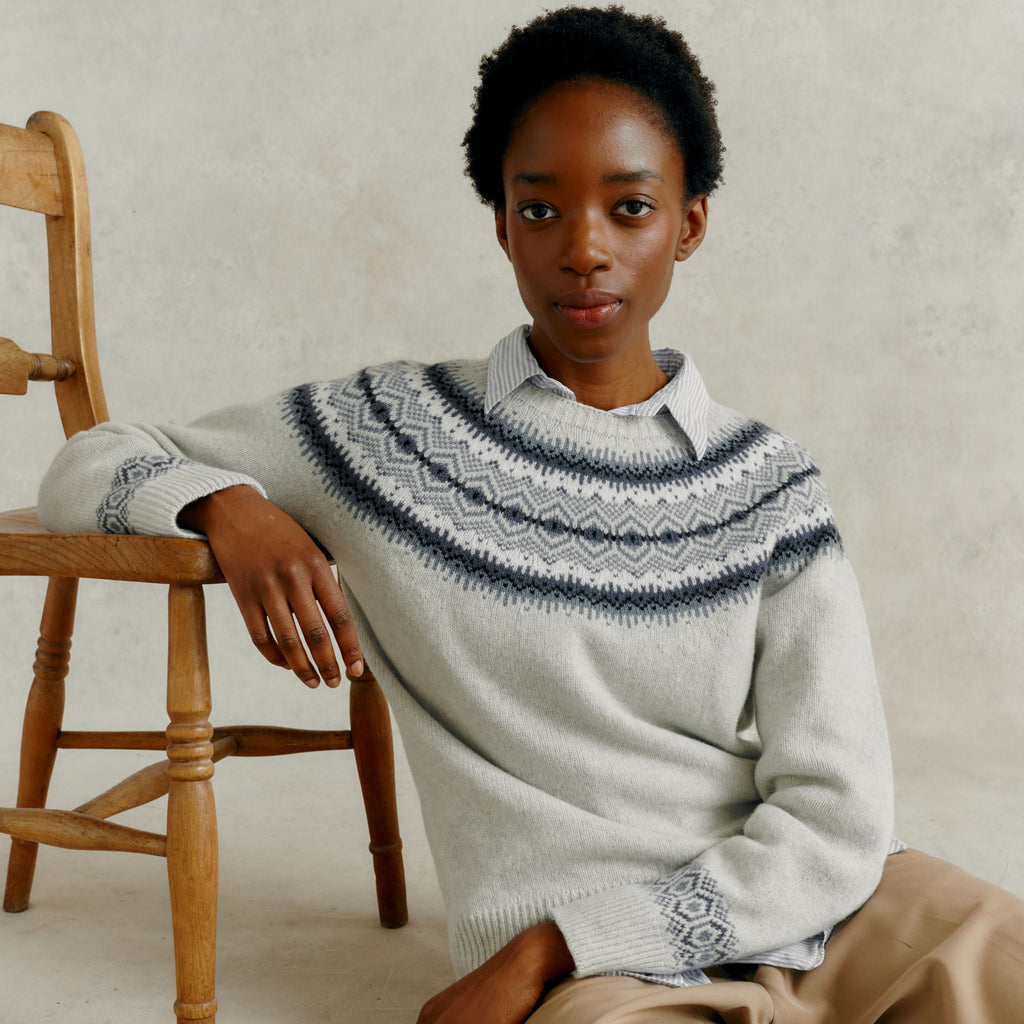 woman sat on floor leaning on a chair wearing a Harley of Scotland Ladies Yoke Jumper - Nuage