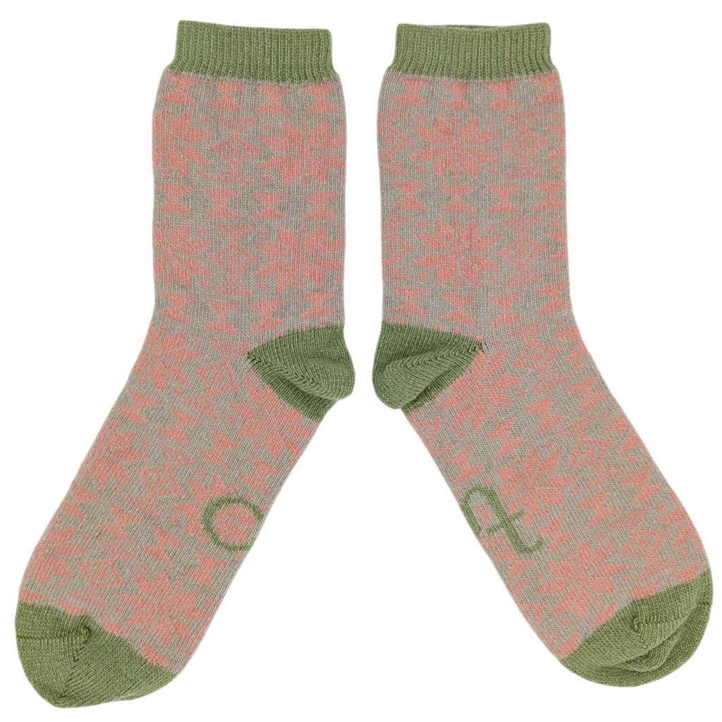 Pair of socks with a pattern and green accents on a white background