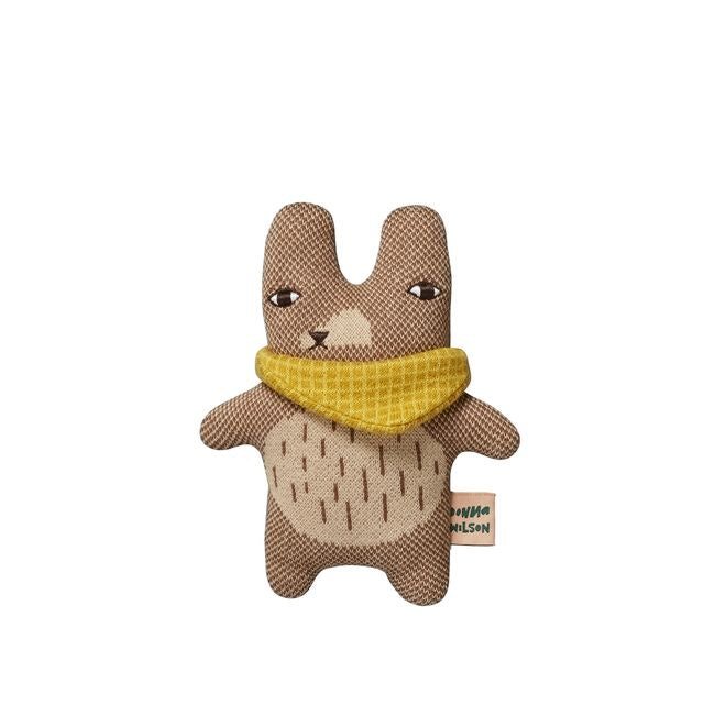 Stuffed animal toy with a yellow scarf on a white background