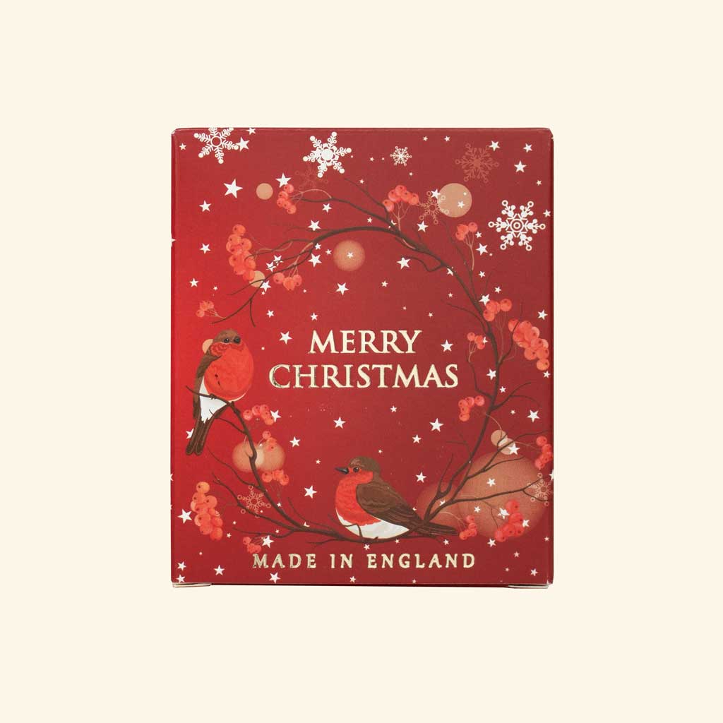 Red Christmas-themed box with birds and 'Merry Christmas Made in England' text on a beige background