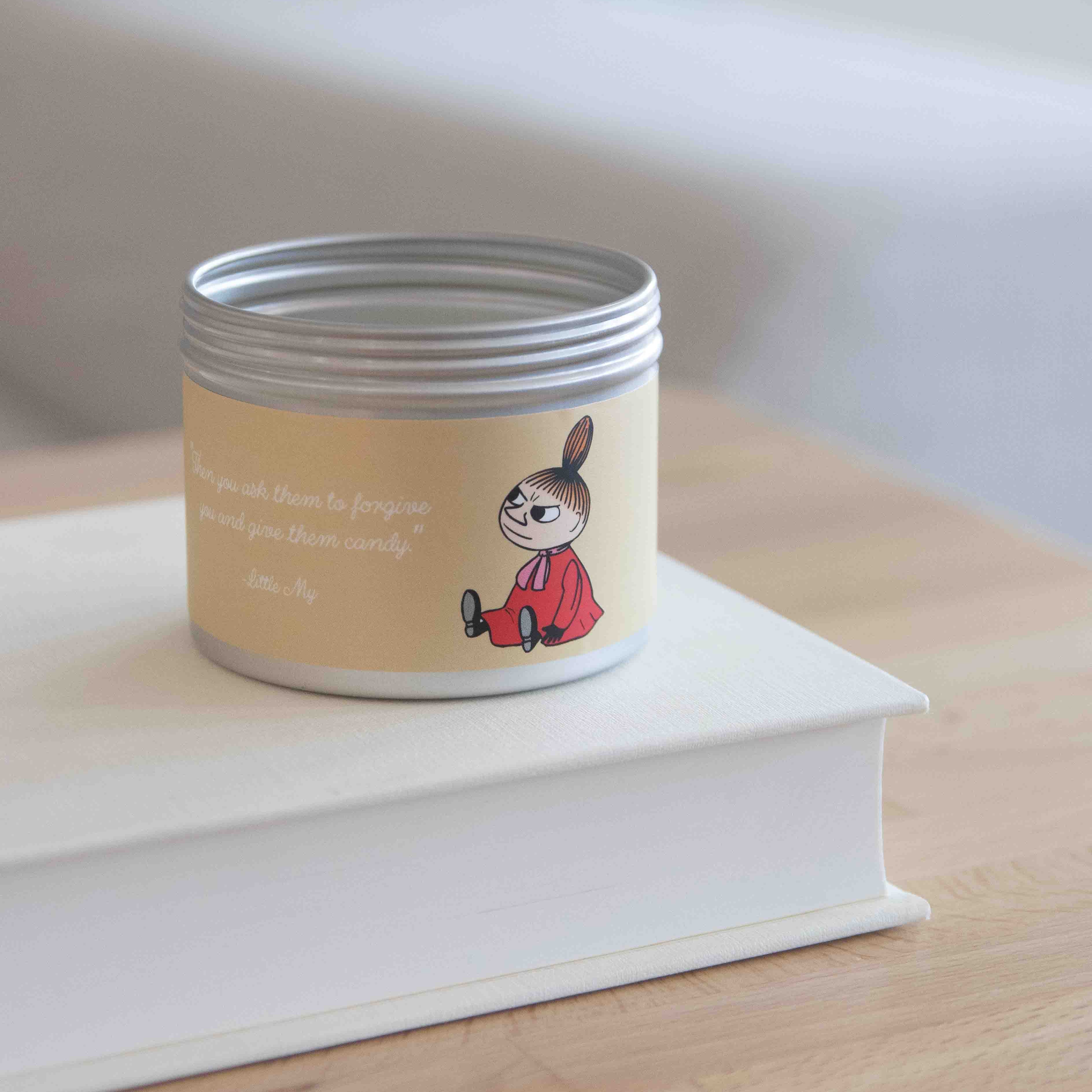 Silver tin canister with a pale yellow label featuring a Little My illustration and text.