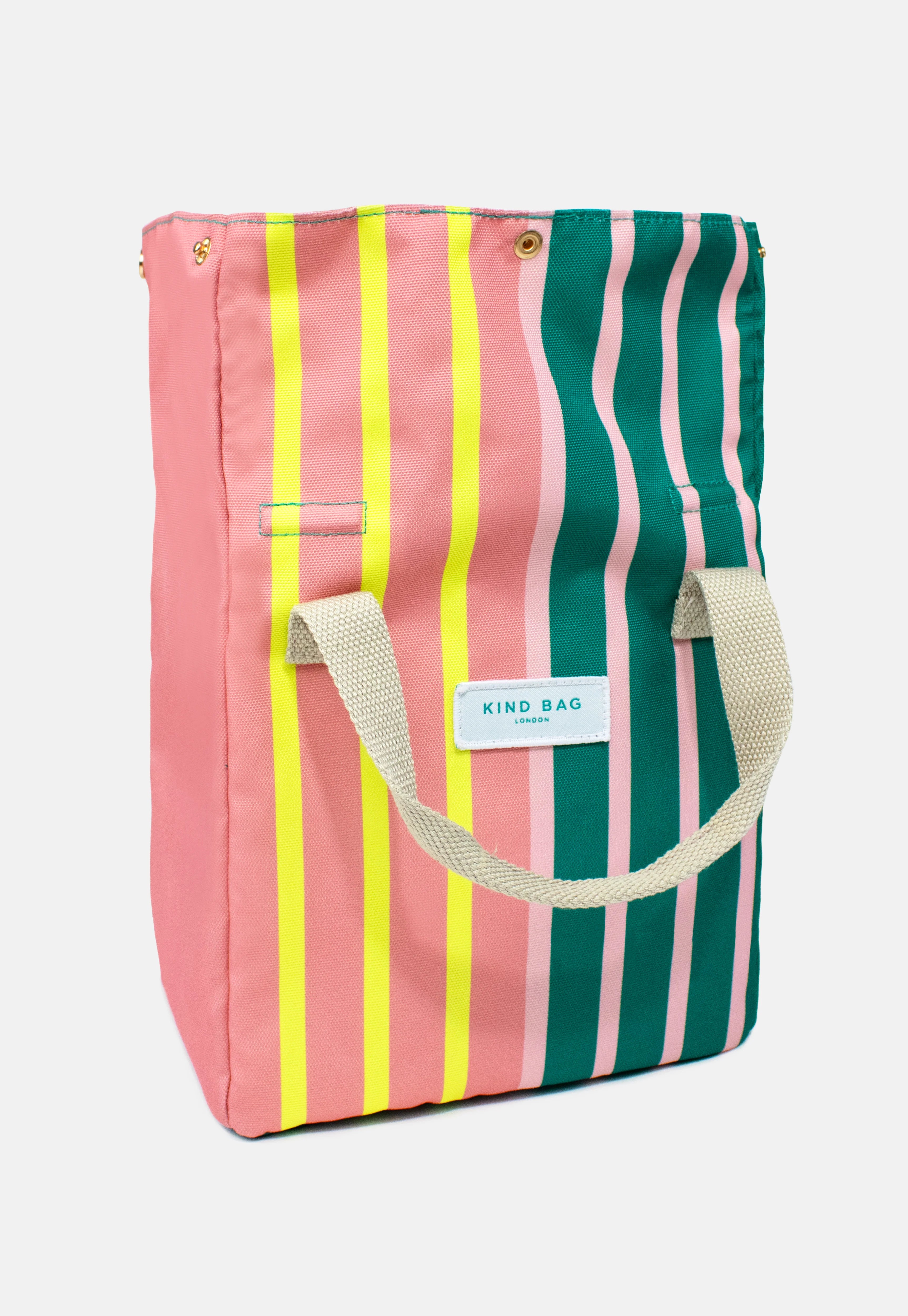 Kind Bag London striped tote bag in pink, green, and yellow.  Features beige canvas handles.