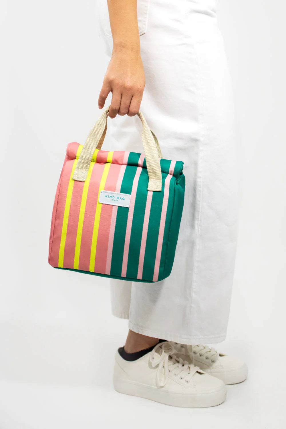 Kind Bag London striped insulated lunch bag in pink, green, and yellow.