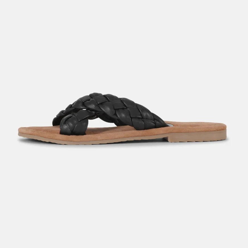 Black braided leather slides with a tan sole. The crisscross straps feature a woven texture. Minimalist summer footwear.