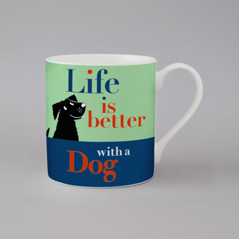 Mug with 'Life is better with a dog' text and dog illustration on a gray background