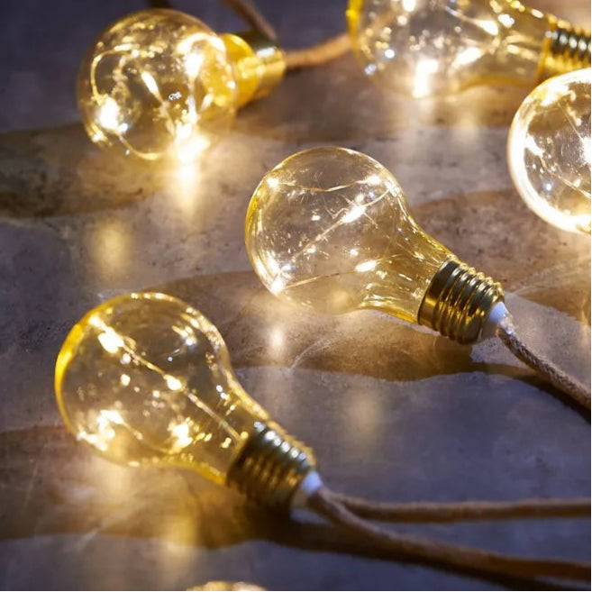 String of warm-white LED Edison bulb lights with a jute cord.