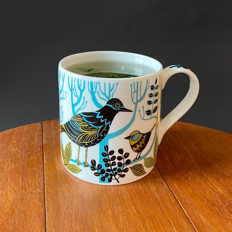 Mug with bird illustration.