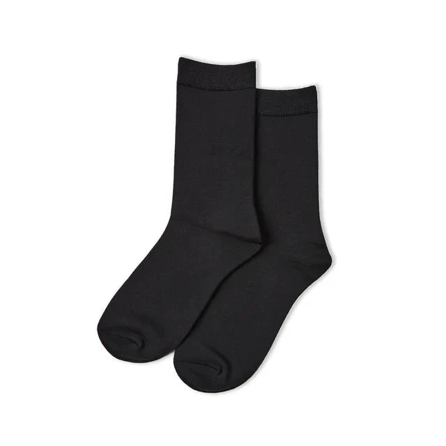 Black socks from Chalk UK, featuring a classic design and comfortable fit. Perfect for any outfit.