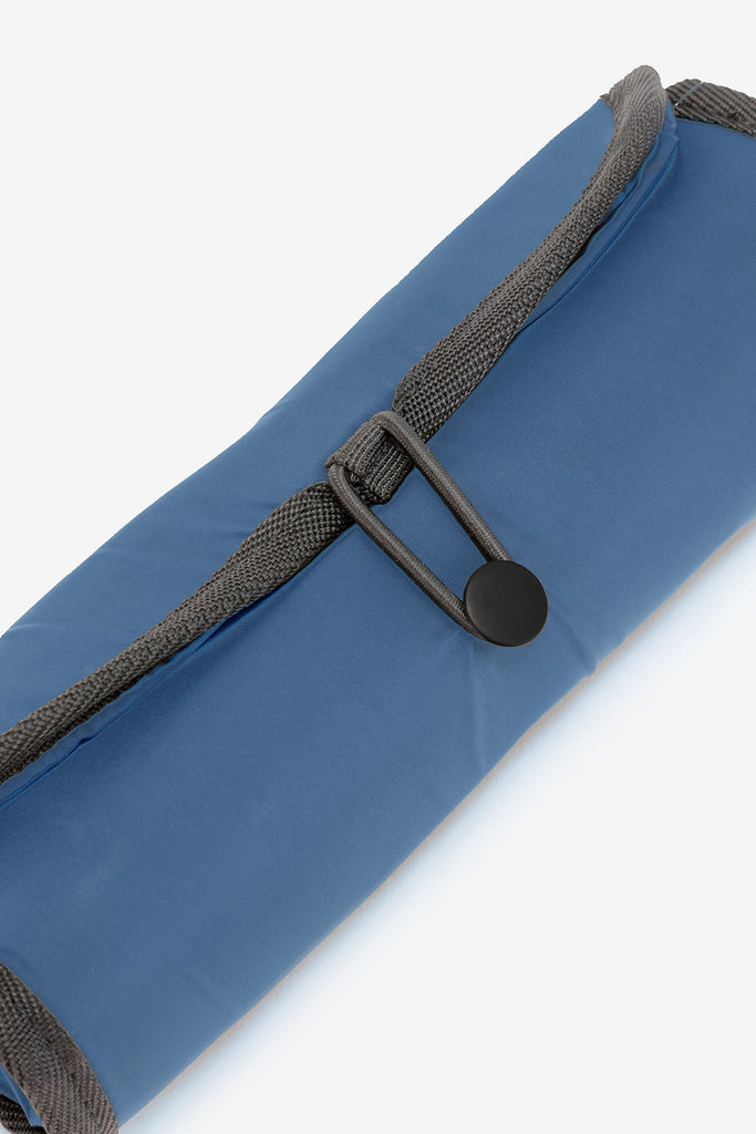 Blue Ecoalf bag with a dark grey strap and button closure, designed for practicality and style.