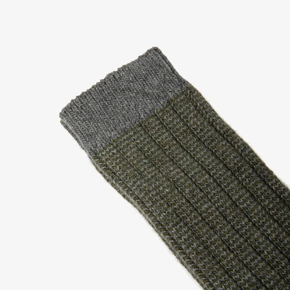 Pair of gray and green socks on a white background