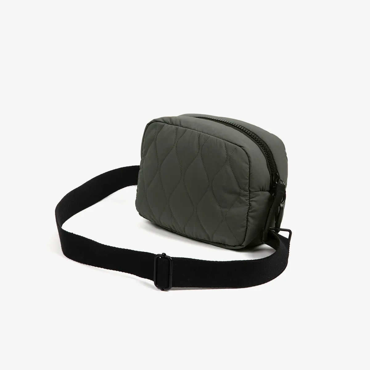 Green quilted bag with a black strap on a white background