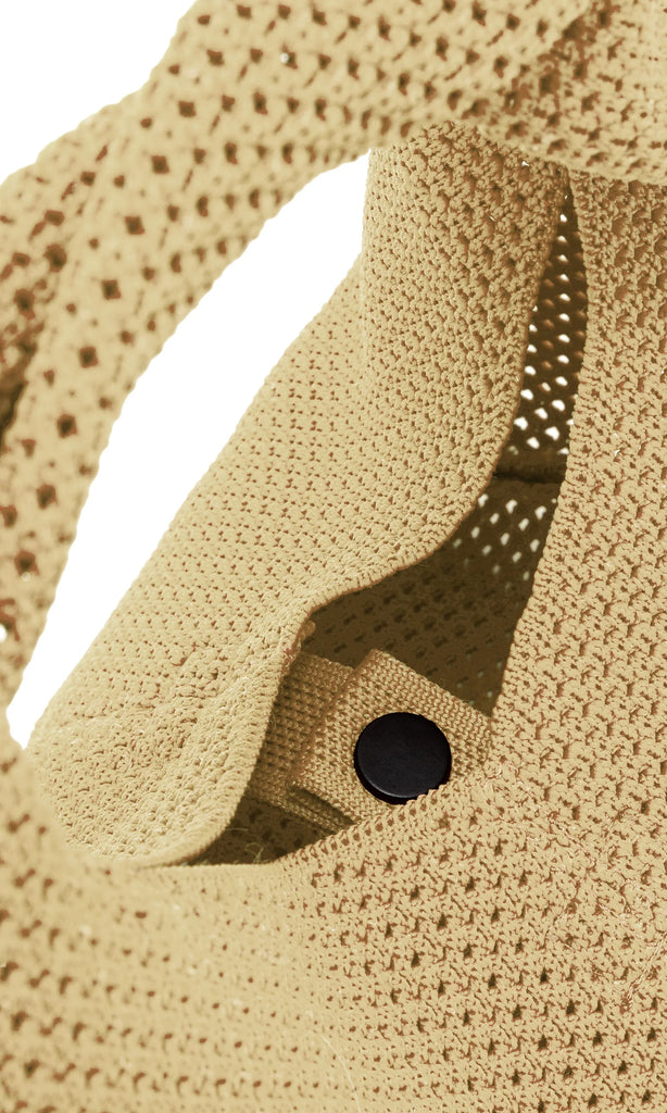 Ecoalf bag in light beige with a black snap closure, featuring a woven texture.
