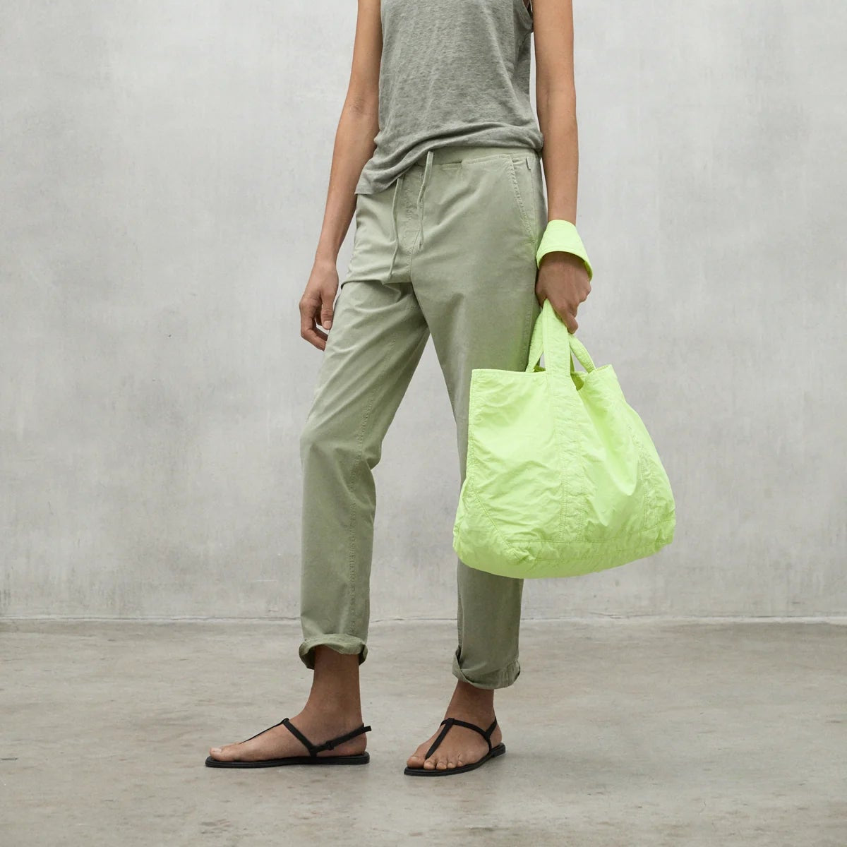 Light green reusable tote bag with double handles.