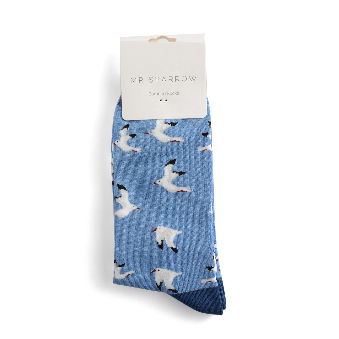 Light blue bamboo socks by Mr. Sparrow, featuring a repeating pattern of white seagulls in flight.
