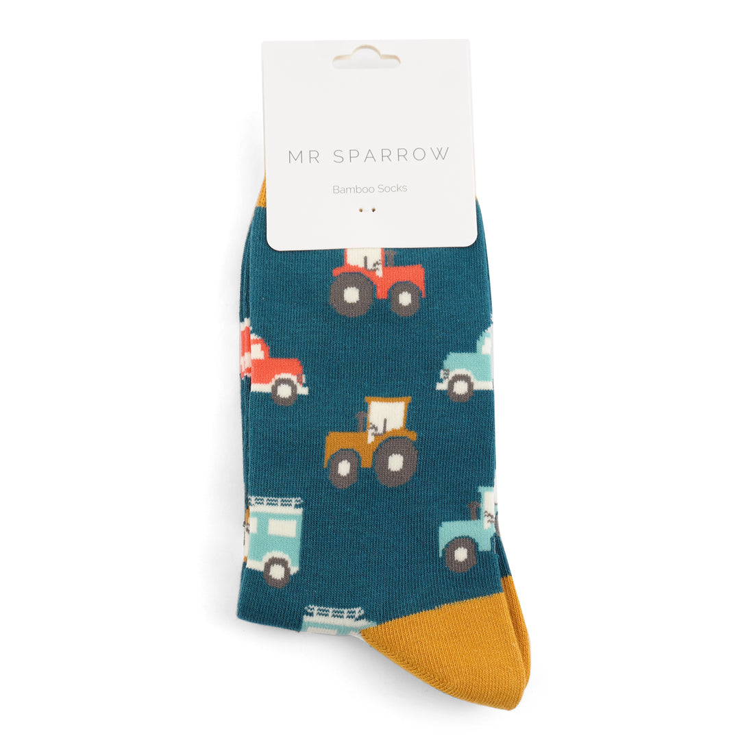 Teal bamboo socks with a repeating pattern of colorful vintage cars and tractors.  Mr. Sparrow brand.