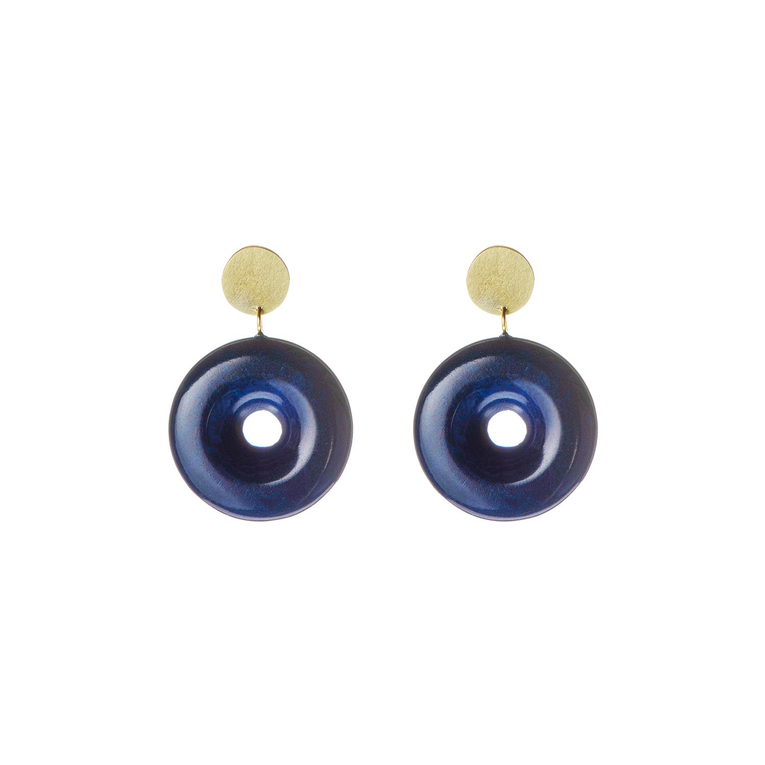 Pair of dark blue circular earrings with gold tops.  Each earring features a central hole.