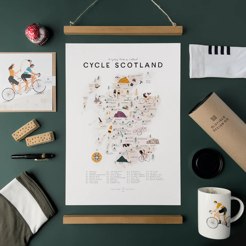 Illustrated map of Scotland highlighting 50 cycling climbs; includes key, compass rose, and cyclist icons.
