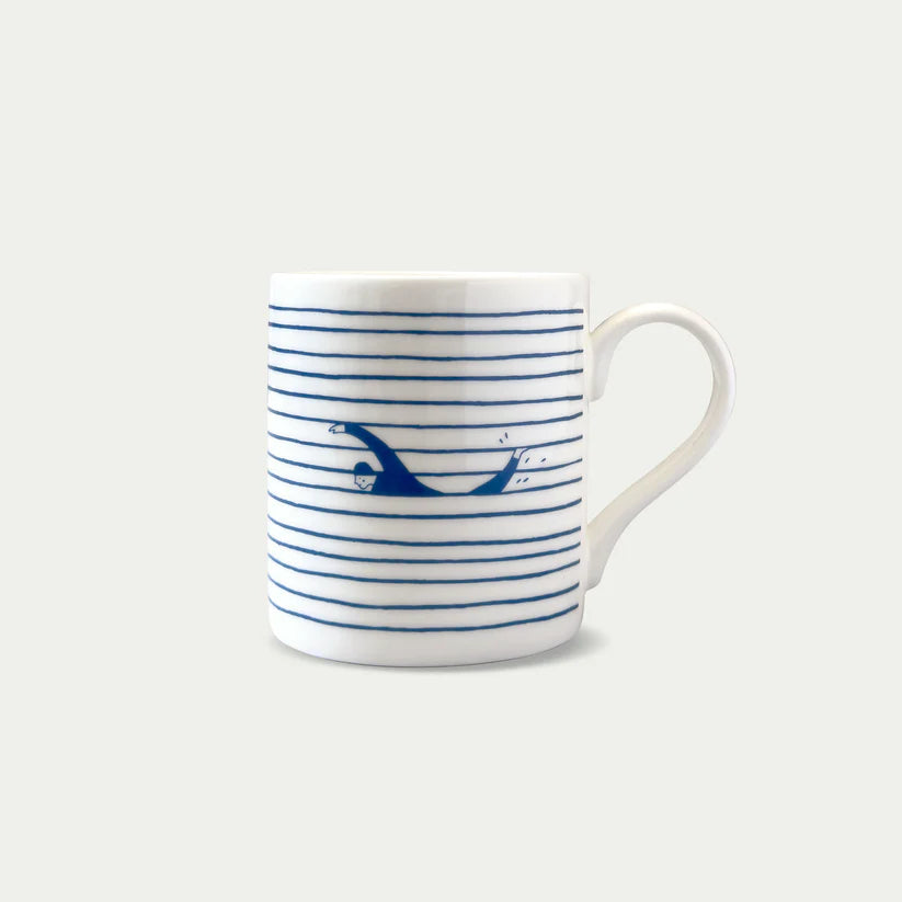 White mug with blue horizontal stripes and a graphic of a person swimming underwater.