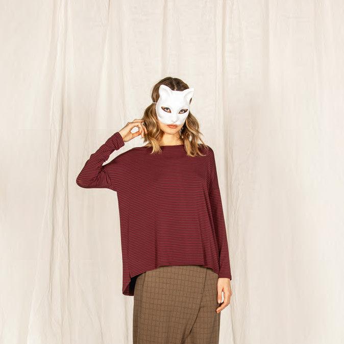 Burgundy striped long-sleeve oversized top with a slightly high-low hemline.