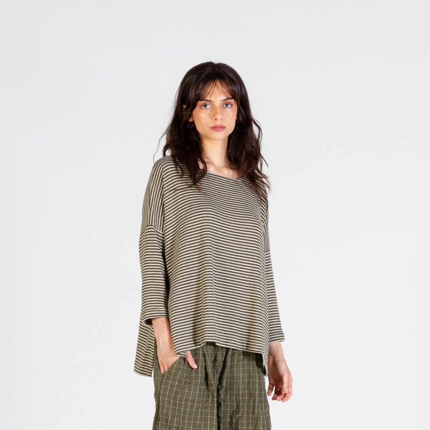 Beige and dark brown horizontally striped, loose-fitting, three-quarter sleeve top.