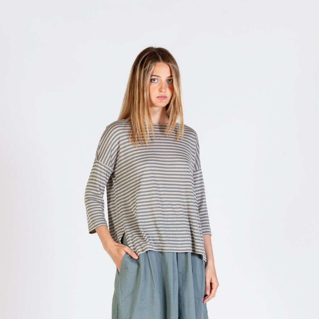 Pale Blue and oatmeal / white striped top with 3/4 length sleeves, dropped back hem and slight split side. 