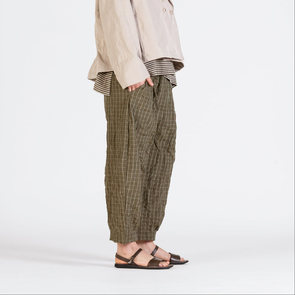 Alga green bubble trousers with fine white line grid pattern. 