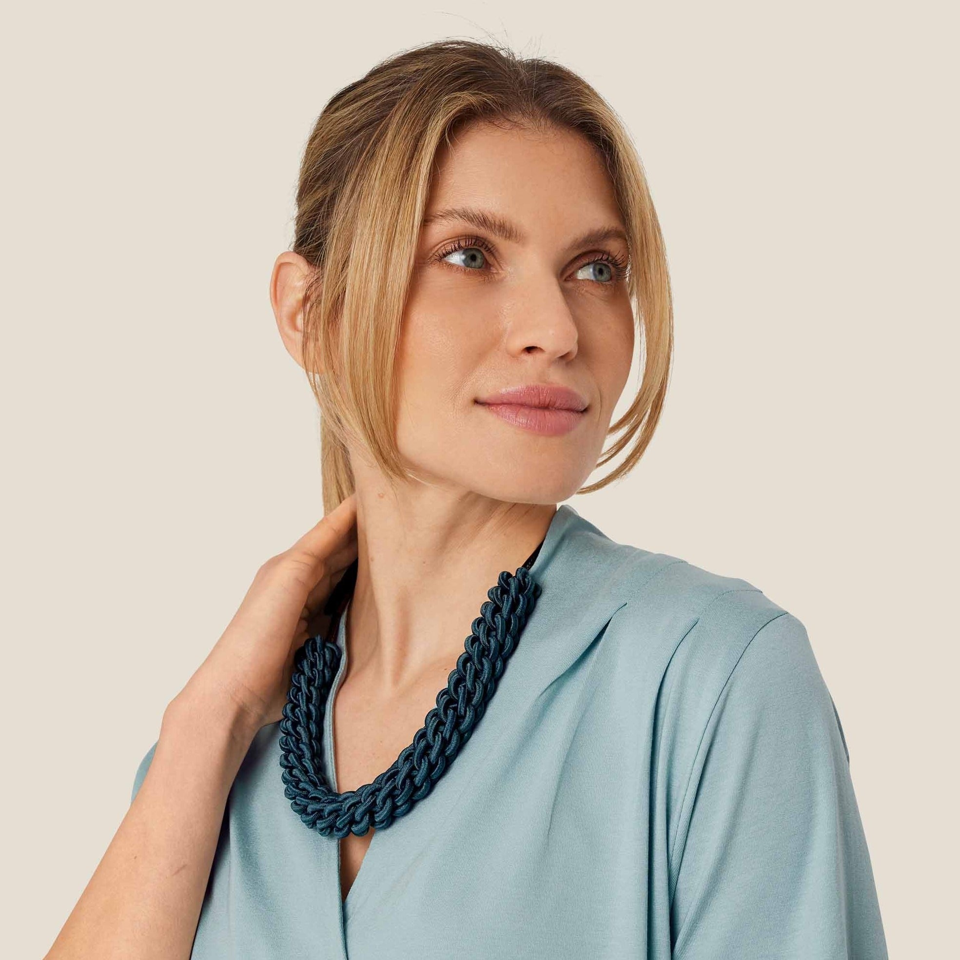 Dark teal braided necklace; thick, chunky rope design.