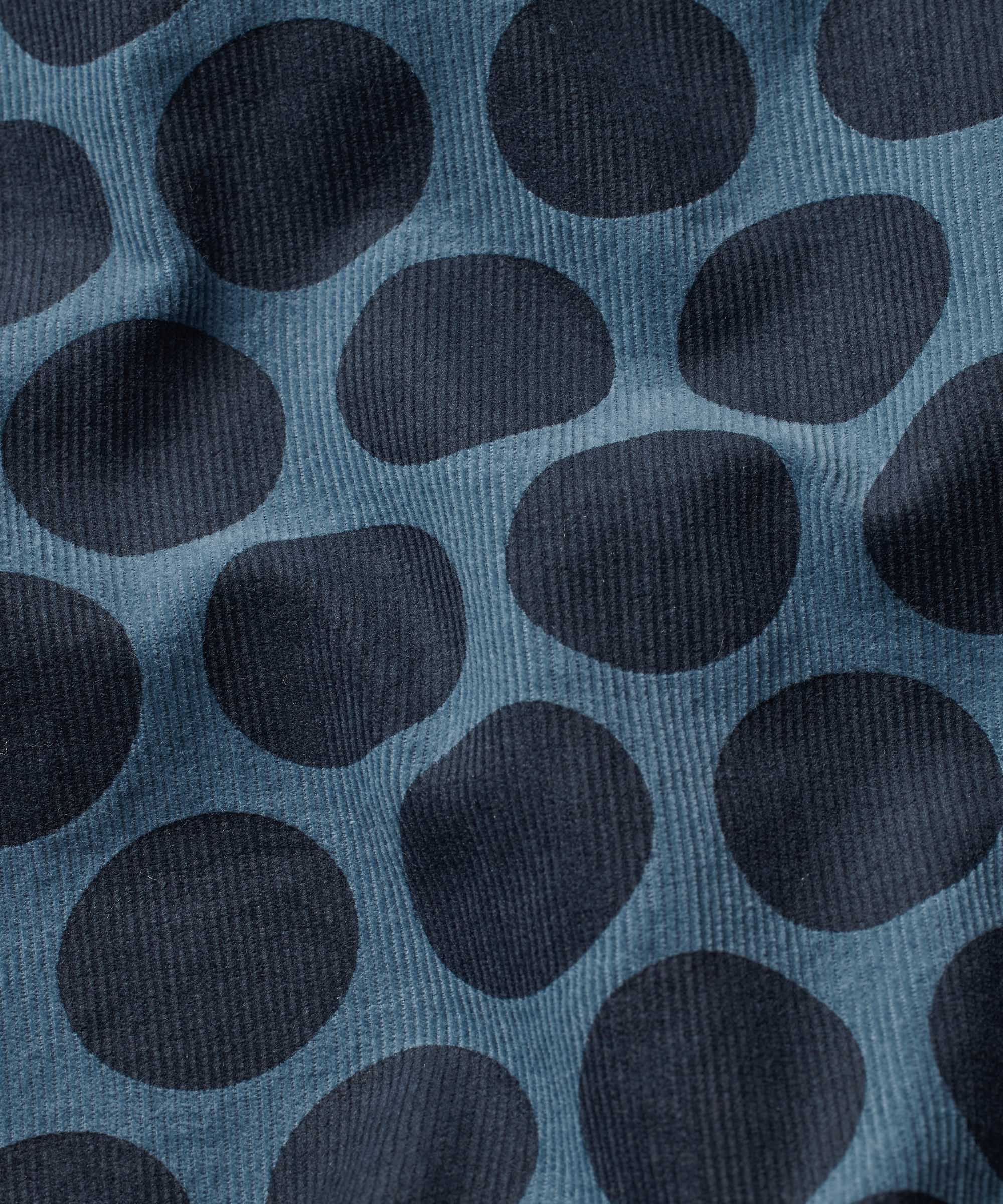 Pattern of dark blue circles on a textured blue background