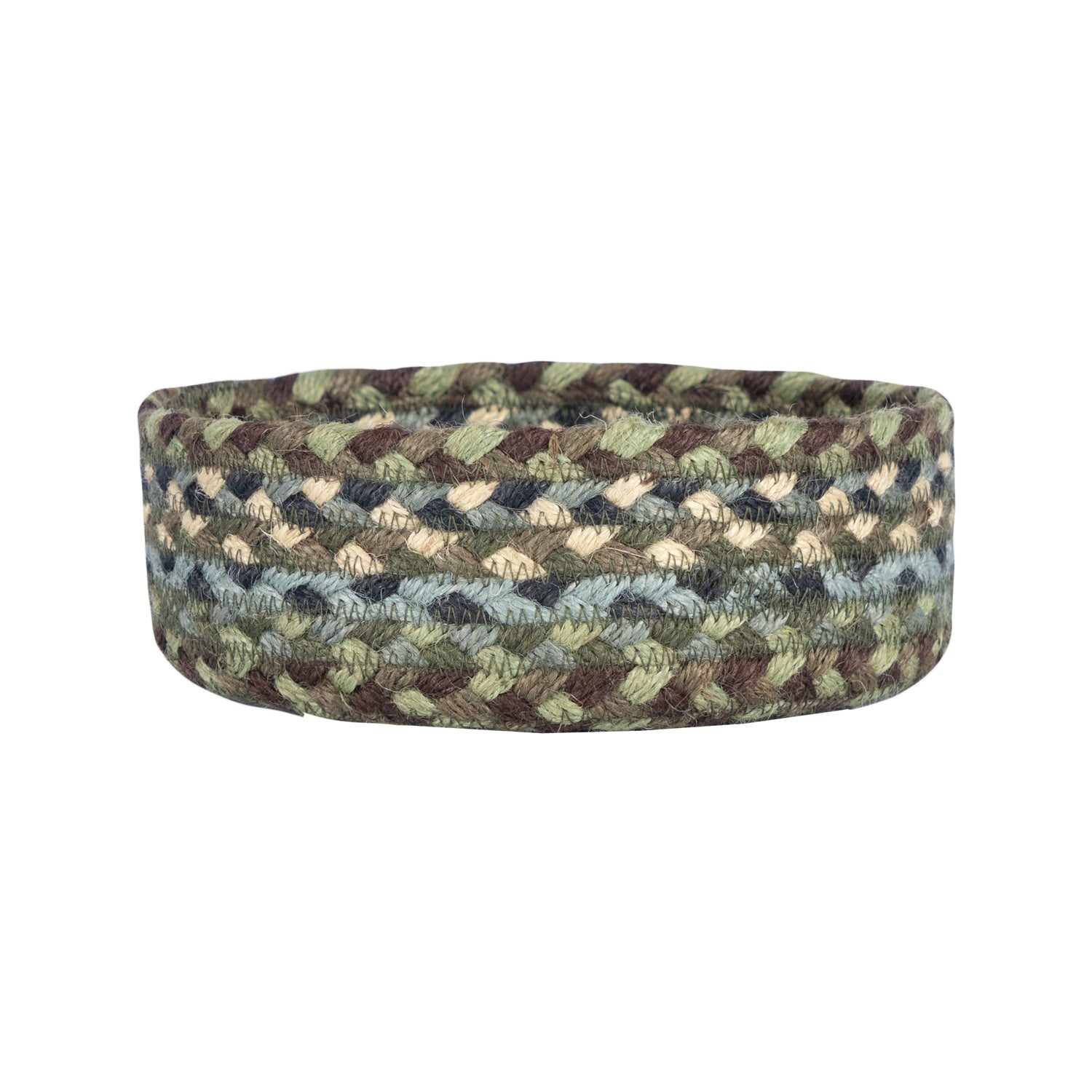 Round braided jute basket with a green, brown, and beige geometric pattern.