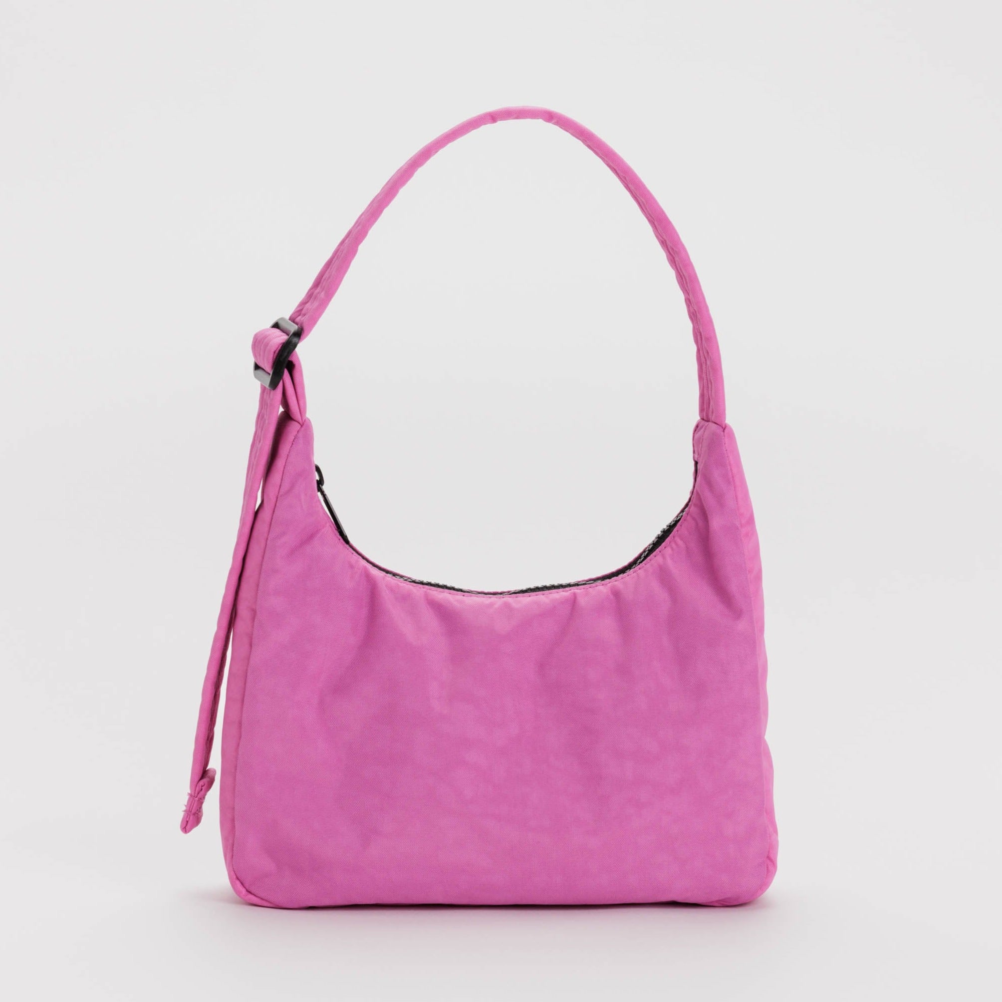 Pink nylon shoulder bag with a curved silhouette and a single top handle.