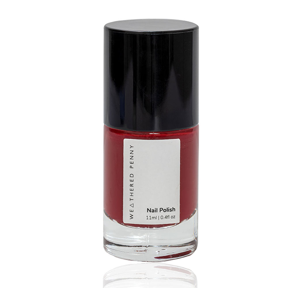 Bottle of Weathered Penny nail polish; dark red color, black cap, 11ml.