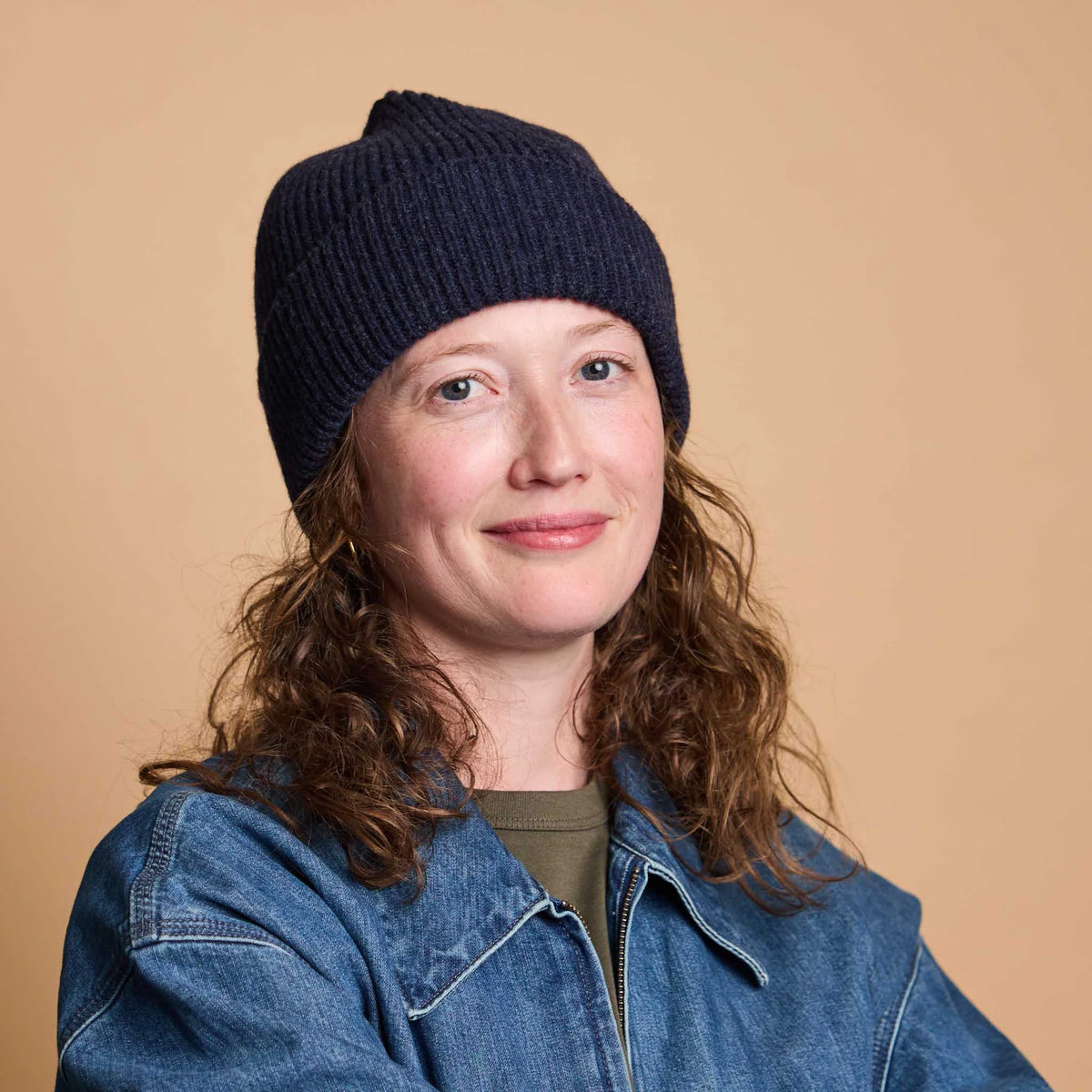 women wearing a navy blue wool beanie