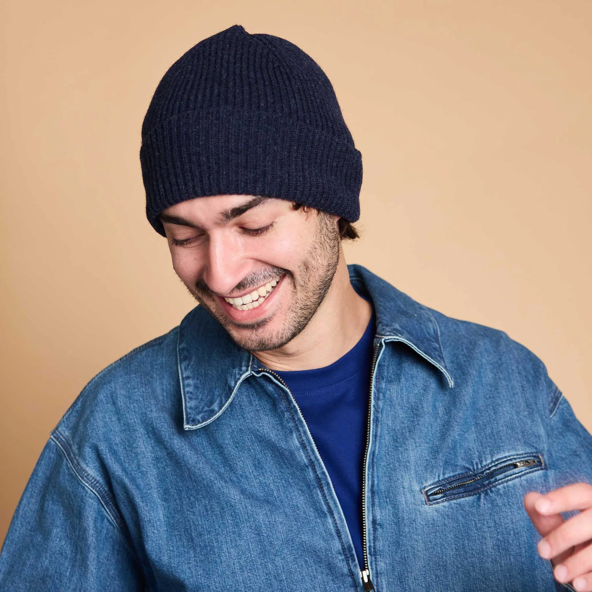 man wearing a navy blue wool beanie