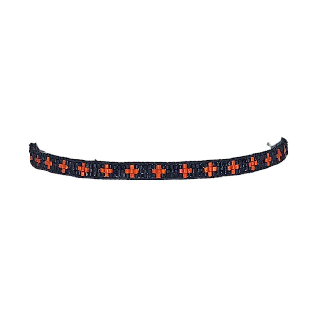 Black beaded bracelet with repeating orange cross pattern.