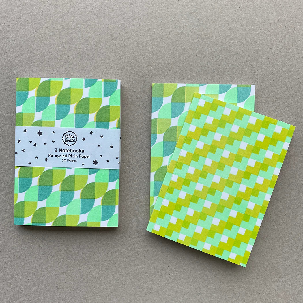 Two small notebooks with geometric green and white patterns. Recycled paper, 50 pages each.