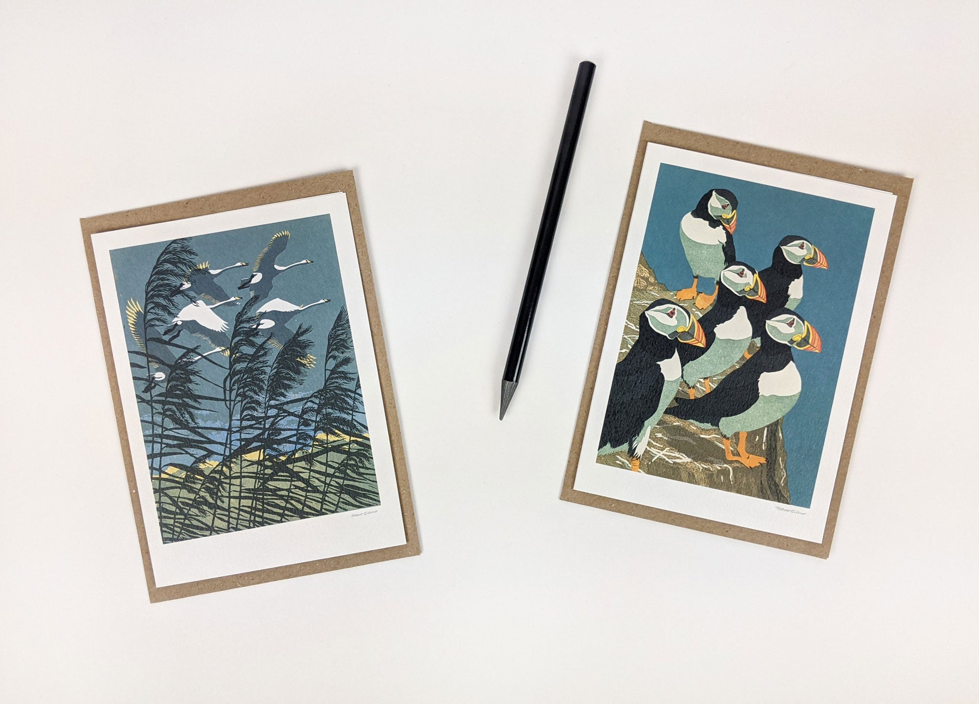 Two greeting cards featuring bird illustrations.