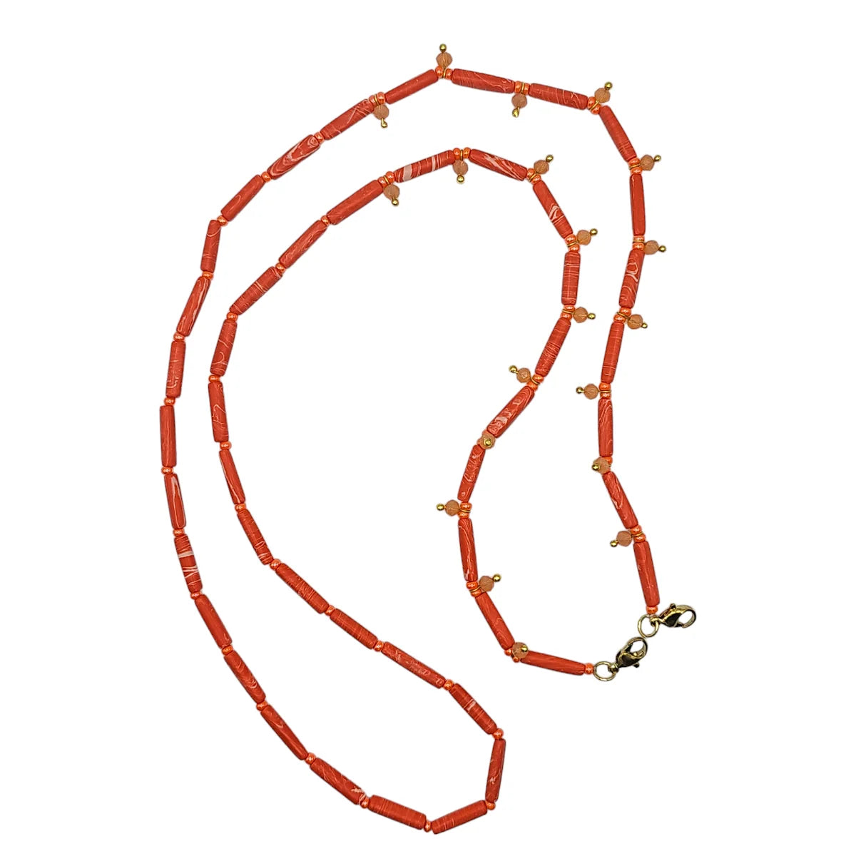 A coral-red beaded necklace with small gold-toned spacer beads and a gold lobster clasp, displayed on a solid white background.