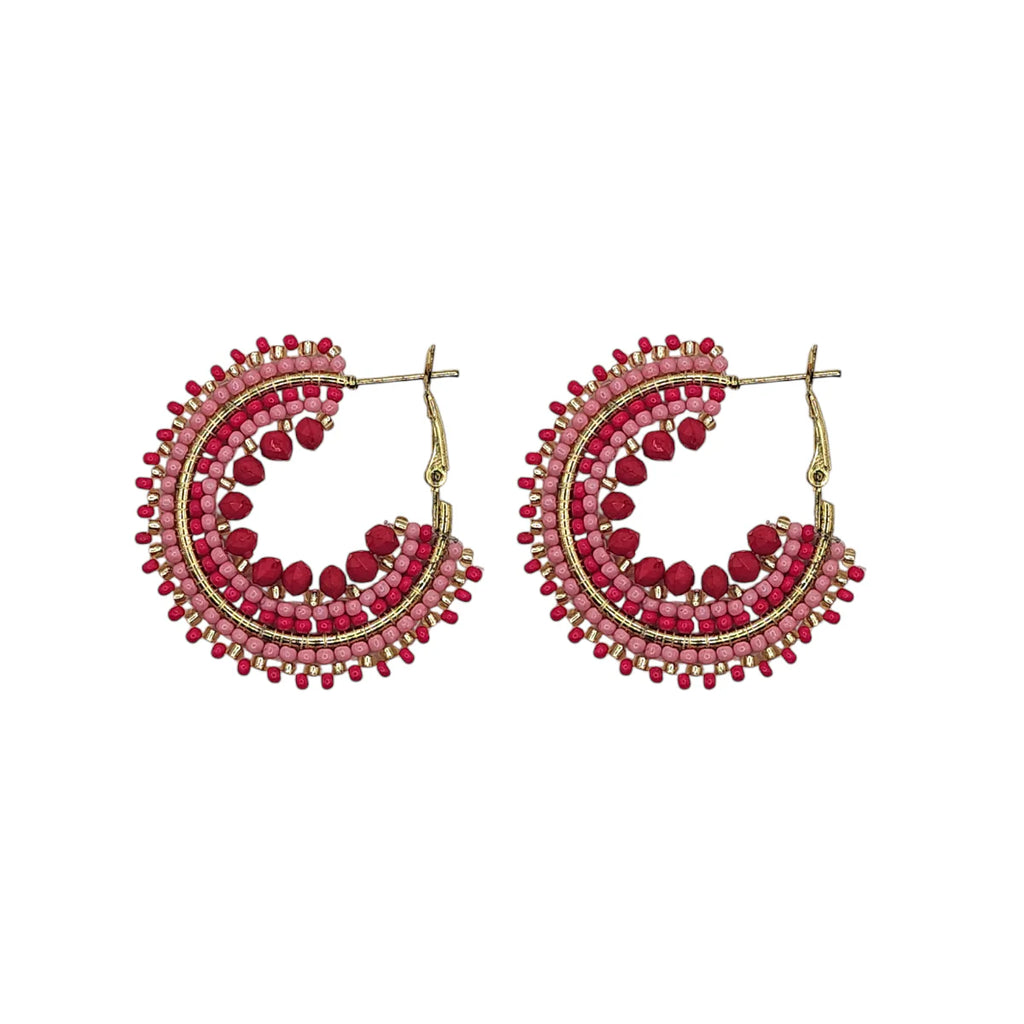 Pair of beaded hoop earrings.  Pink and red beads are arranged in concentric circles on gold-toned hoops.