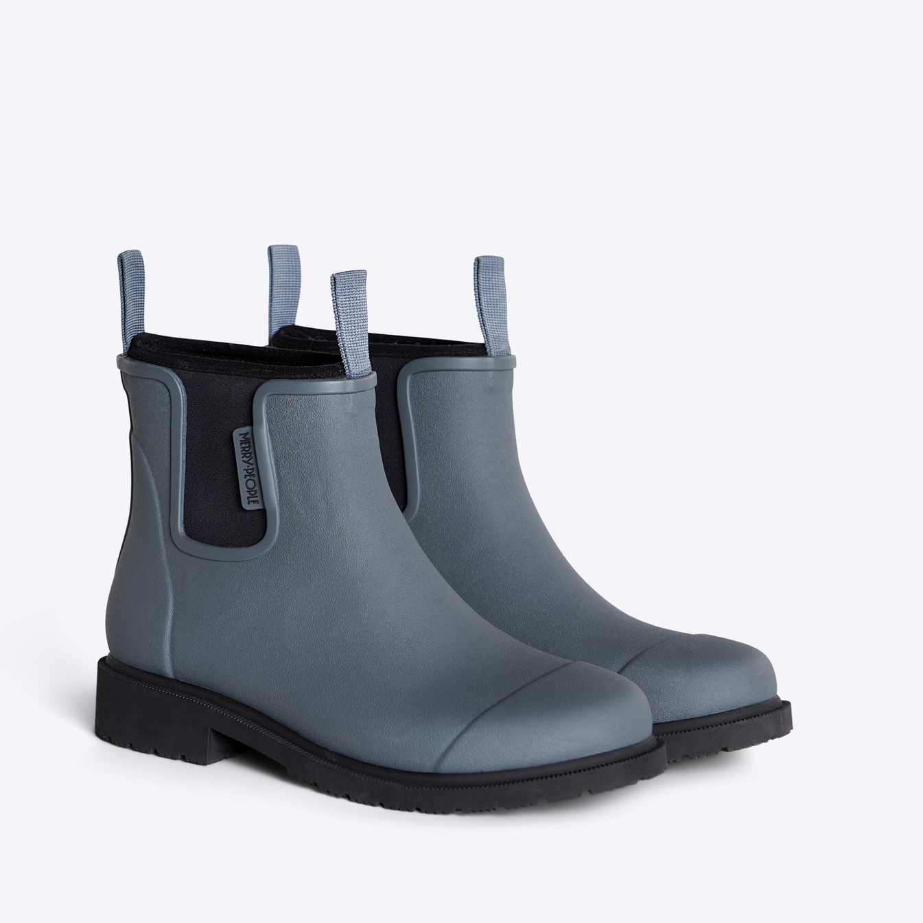 Pair of Merry People gray rubber ankle boots with black soles and pull tabs.