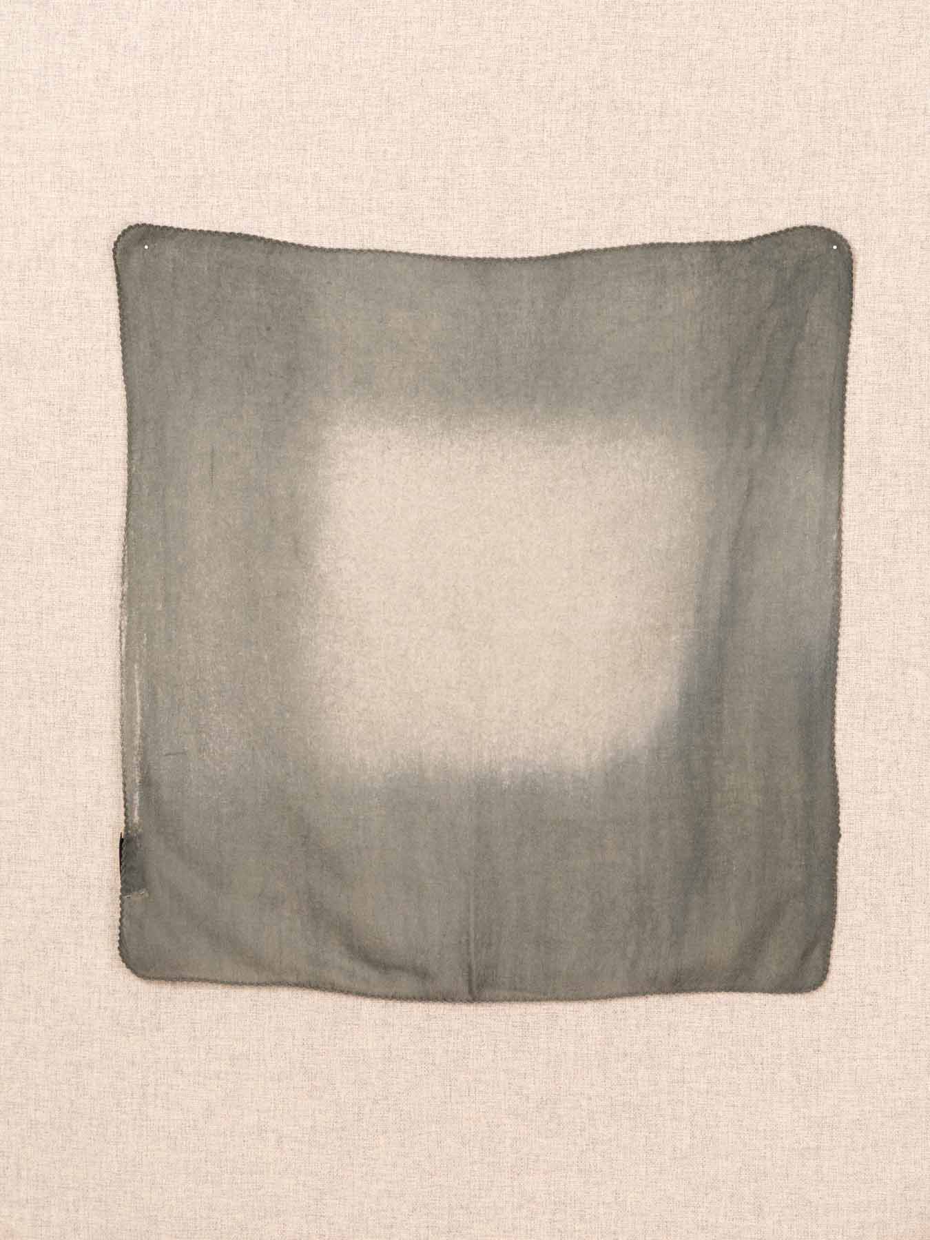 Gray pillow on a beige background